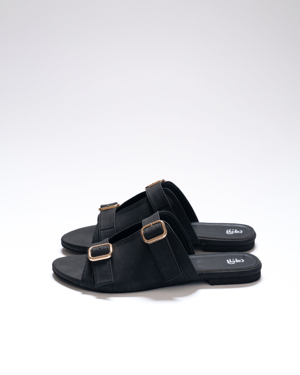 stride-buckle-dusty-black-flat-sandals-urban-commute